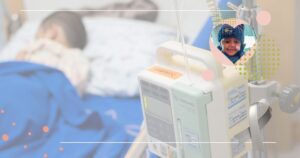 Child in hospital bed with medical equipment, smiling in inset photo.