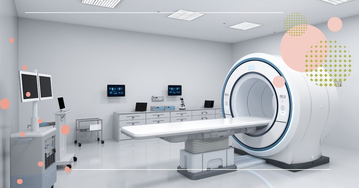 Modern hospital imaging room with a large MRI scanner, patient table, and surrounding medical monitors and equipment in a clean, bright environment.